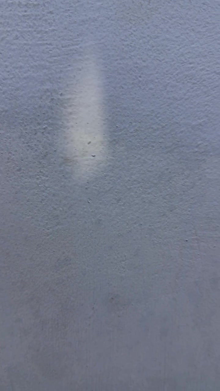 Dynamic Shadows Moving Across a Textured Grey Wall