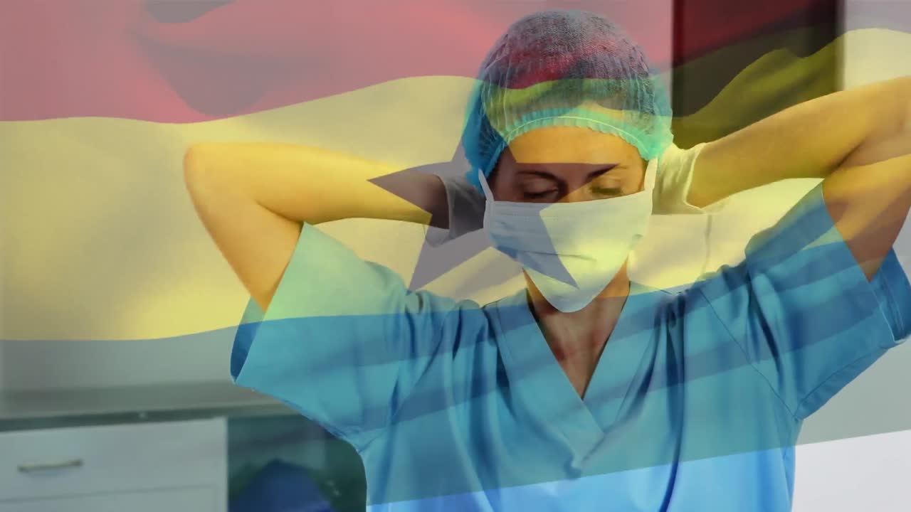 Animazione della bandiera del Ghana che sventola su un chirurgo in sala operatoria