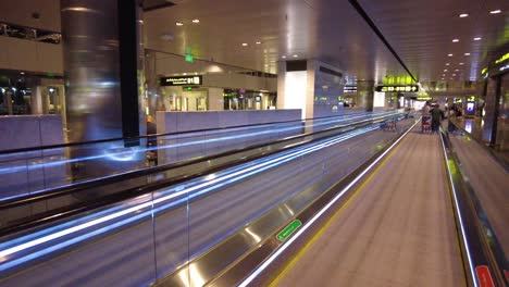 airport moving walkway at night