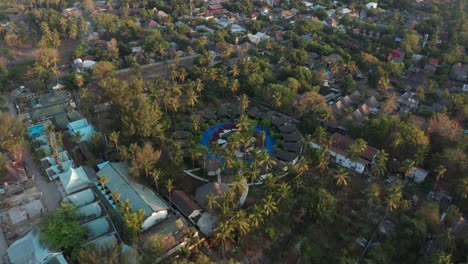 exotic tropical gili air island bali indonesia, pull back tilt up aerial overview