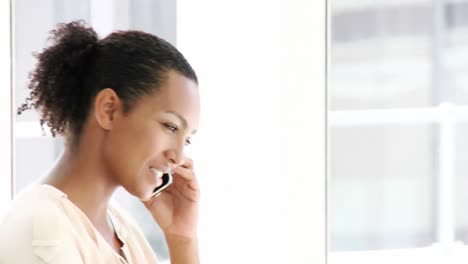 charming businesswoman talking on phone
