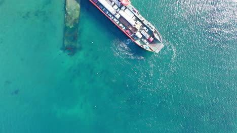 Aerial-Bird-Eye-View-Of-Ferry-Boat-Waiting-At-Big-Island-of-Chiloé,-Chile