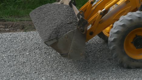 excavator carries gravel in the bucket