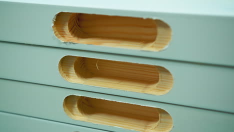 doors production. stack of wooden boards with holes inside. making furniture in the workshop. close-up.