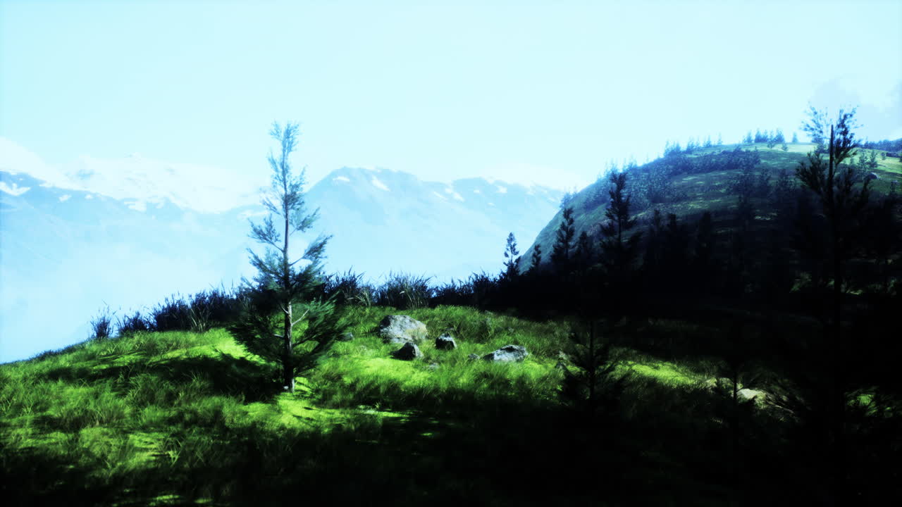 una vista panorámica de una cordillera con un árbol solitario en primer plano.