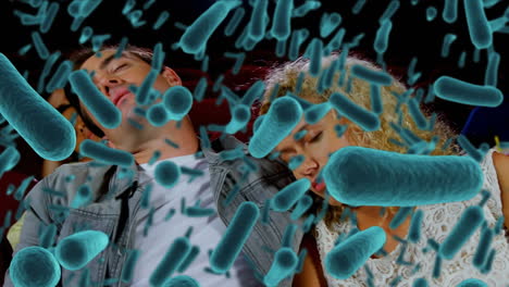 animation of covid 19 cells over people asleep in cinema