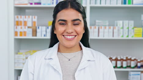 A-smiling-doctor-working-behind-the-pharmacy