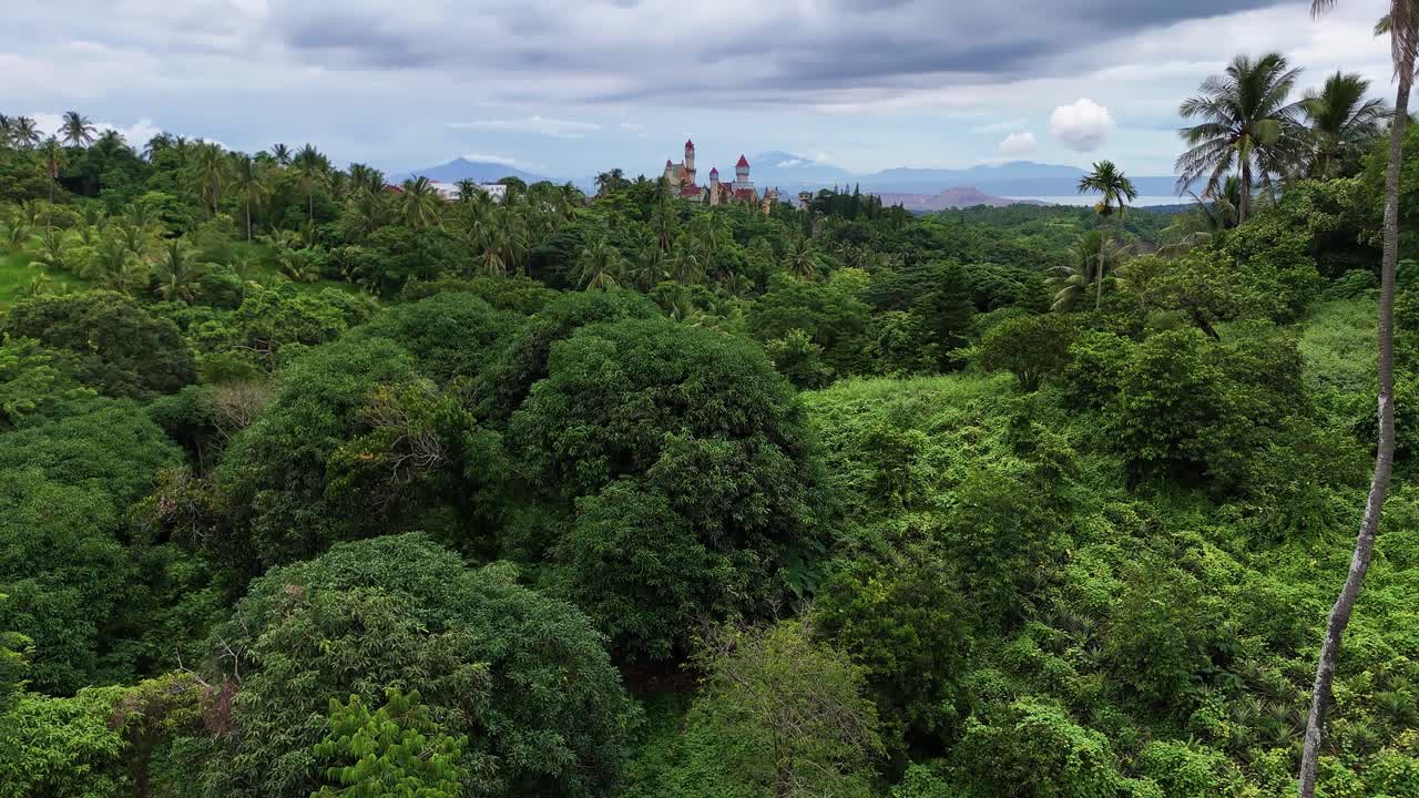 Aerial View of a Fairytale Castle Hidden in a Lush Tropical Jungle