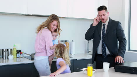 Young-family-having-breakfast-together-in-the-morning