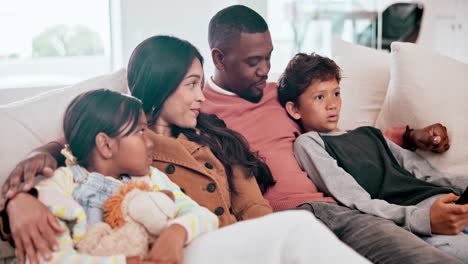happy, smile and family watching a movie on a sofa