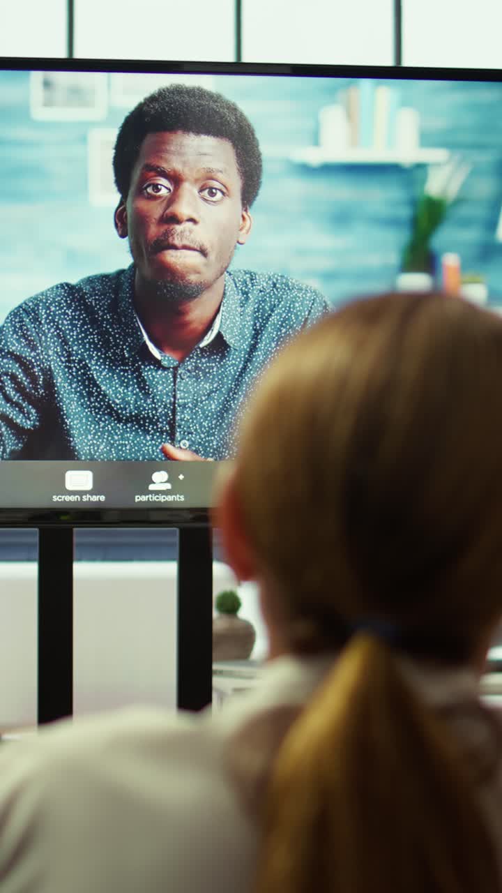 Vertical Video General manager checking on his staff via remote videocall connection