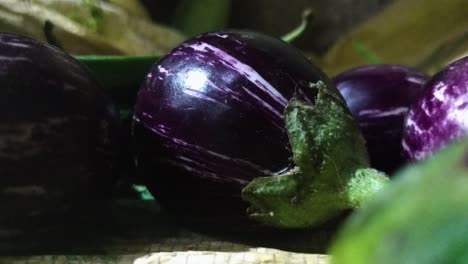 close up of raw indian eggplants on the table