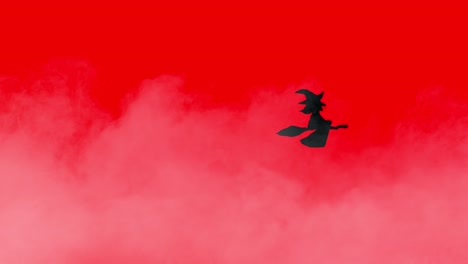 animación de halloween bruja negra volando en una escoba sobre un fondo de niebla rojo