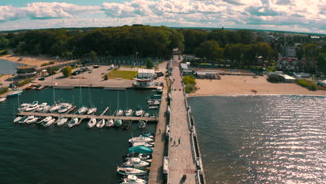 aerial shot of drone flying above pier in puck, poland