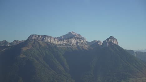 rocky mount semnoz near the town of lake annecy in the french alps seen from the air, aerial plane shot