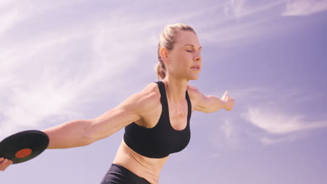 sportswoman practicing discus