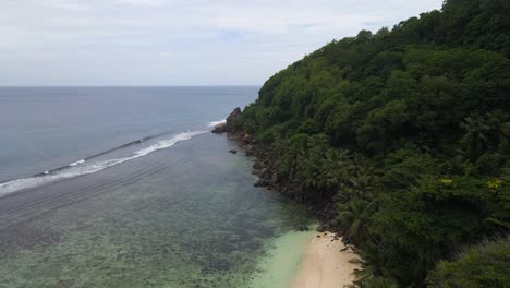 landscapes-in-Seychelles-showing-the-nature,-maountains,-ocean,-sea,-and-massive-granit-rocks-filmed-from-above-with-a-drone-in-4k-with-movement