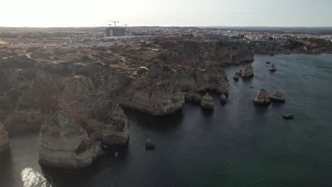 Aerial-view-of-Ponta-da-Piedade-rock-formations-in-Lagos,-Portugal