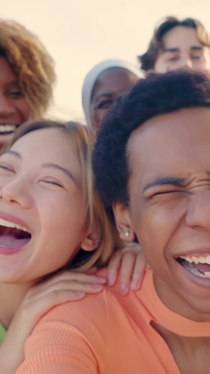 Smiling crazy multi ethnic people taking selfies during sunset