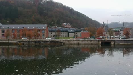 cars passing by next to canal