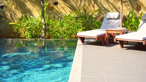 exterior relaxation area by the pool. static shot