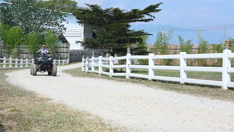 person riding an atv through a white gate