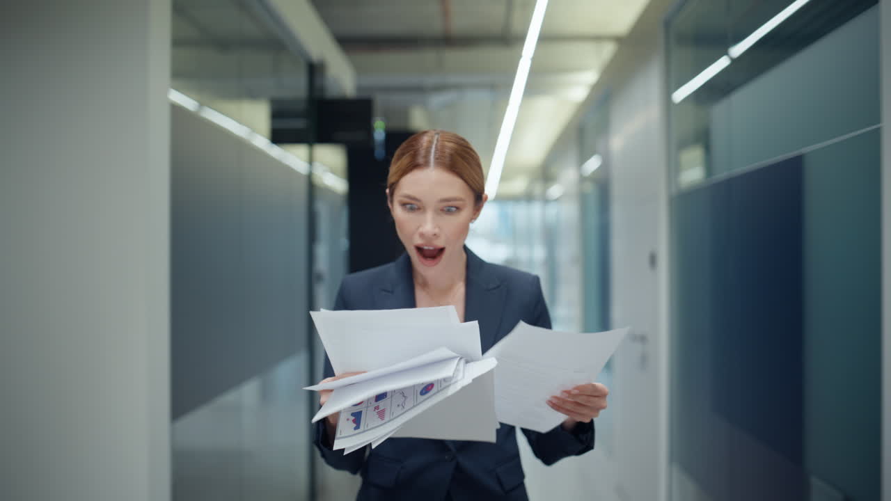 Formal ceo doing paperwork on go in modern grey hall closeup. Manager rejoicing