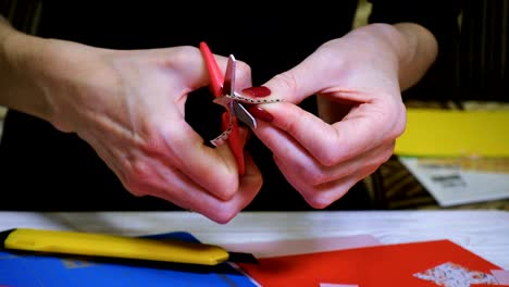 hands of girl making scrap valentine greeting card