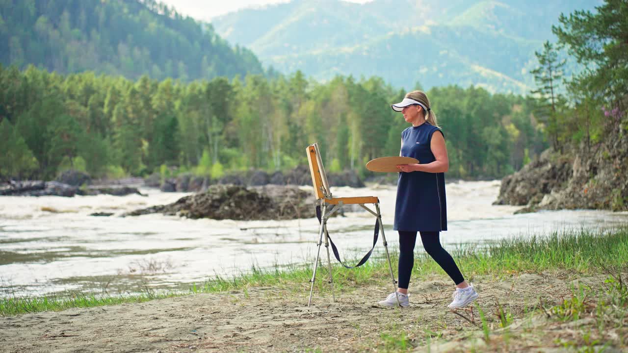 Woman Painting Outdoors by a River