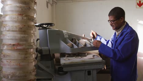 mixed race man working in factory