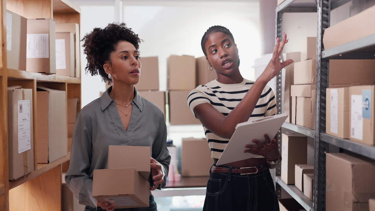 Two Women Collaborating on Inventory Management in a Storage Room