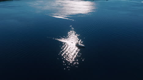 aerial view of a boat on a calm ocean