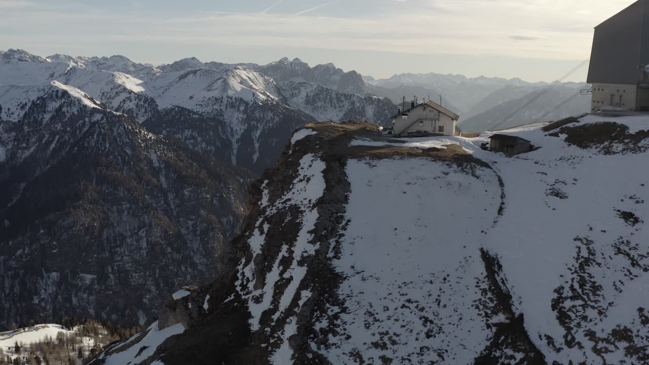 Snowy Mountain Landscape with Alpine Hut and Ski Lift
