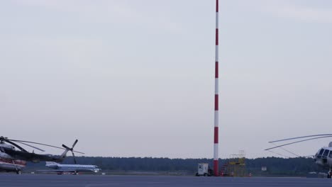 airport scene with helicopters and airplane