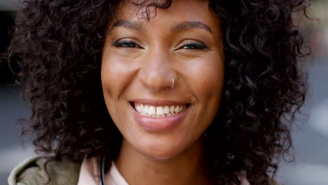 portrait of an african woman with a curly afro