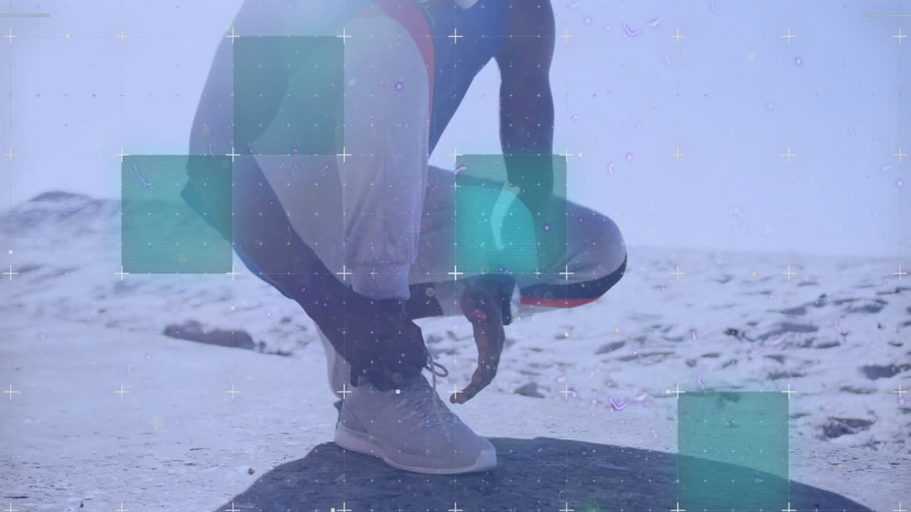 Animation of grid over a running african american man tying shoe