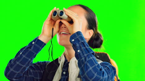 backpacker woman and binocular isolated on studio