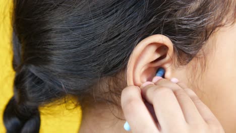 child cleaning ear