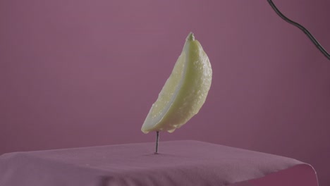 lemon rotating with loop on fuchsia screen for chroma key