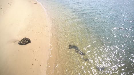 Small-beach,with-small-waves-lapping-on-shore