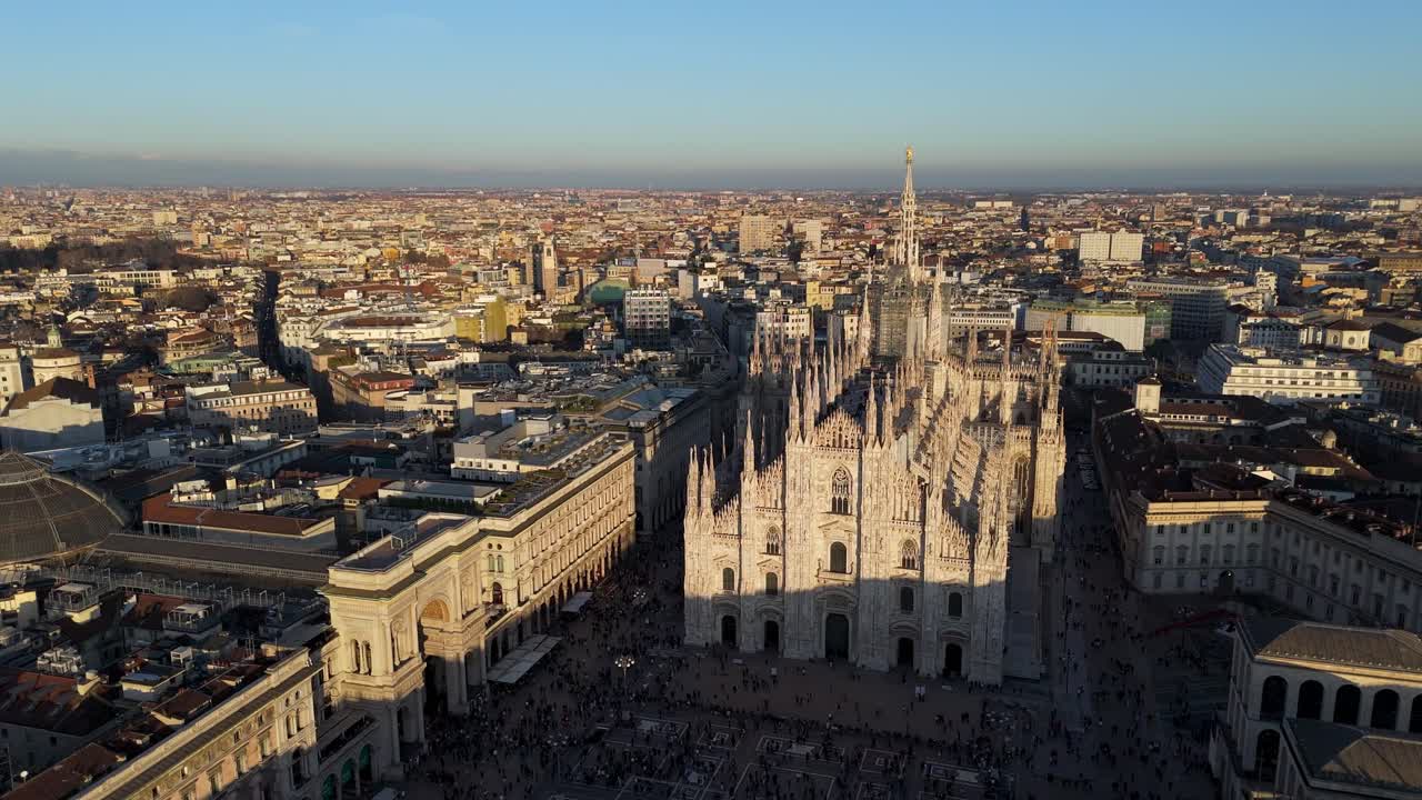 wide angle view of Milan duomo cathedral , drone rotate around historic monument revealing cityscape