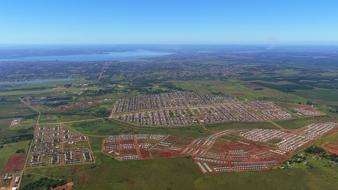 Aerial wide view of Itaembe Guazu in Posadas, Argentina showing large scale residential housing development and urban expansion