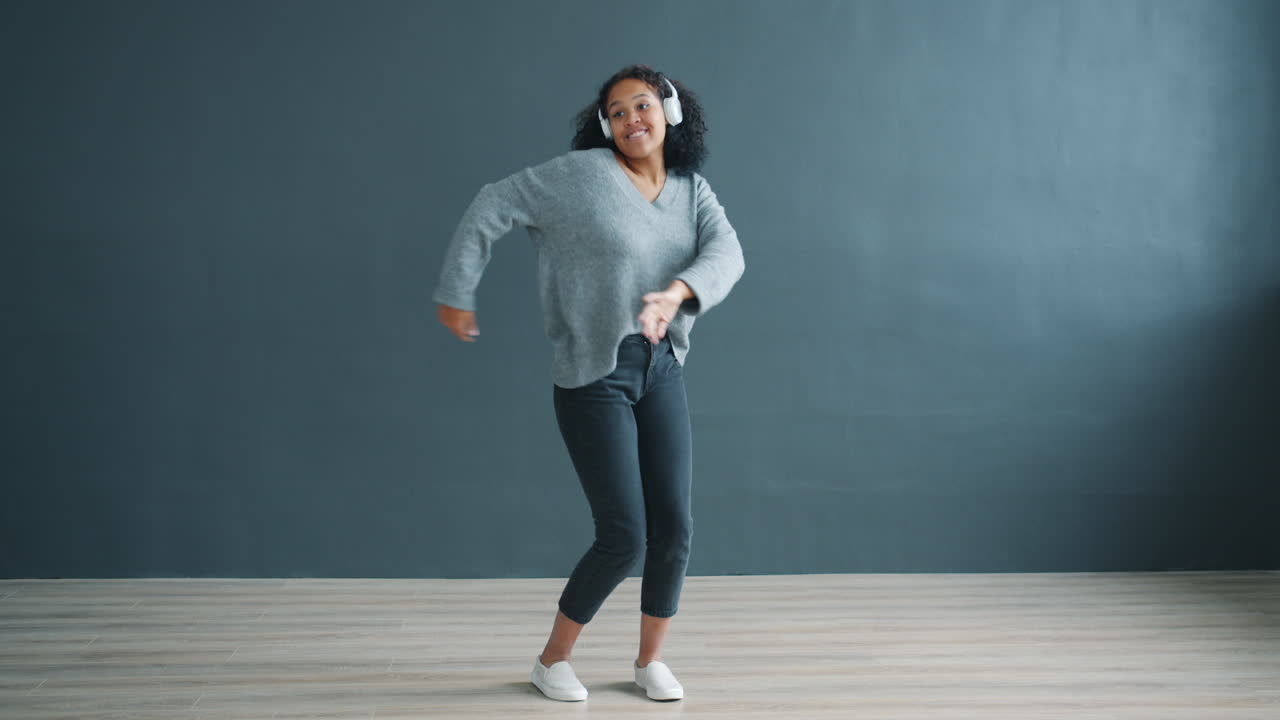 Woman Dancing to Music with Headphones