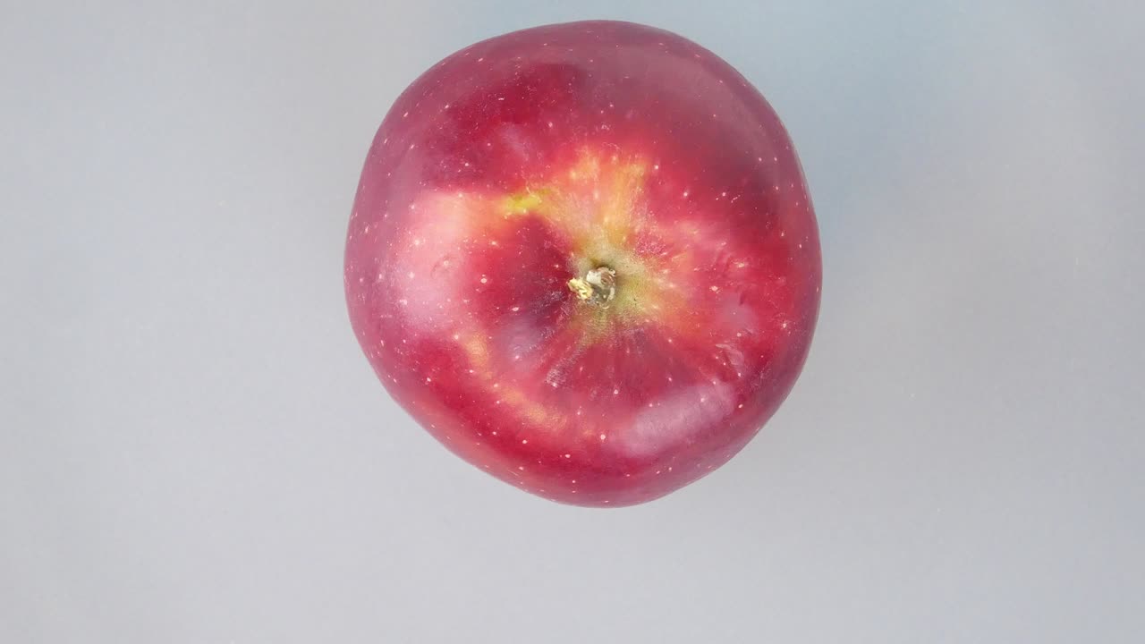 The red apple rotates in a circle. Fruit. Harvest. Video.