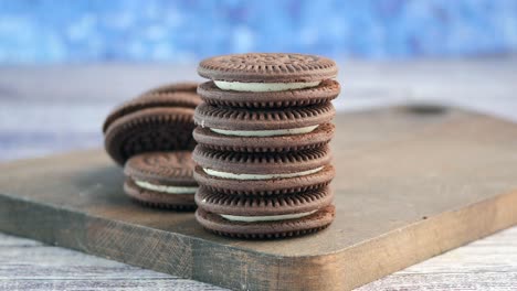 stack of chocolate cookies on wooden board