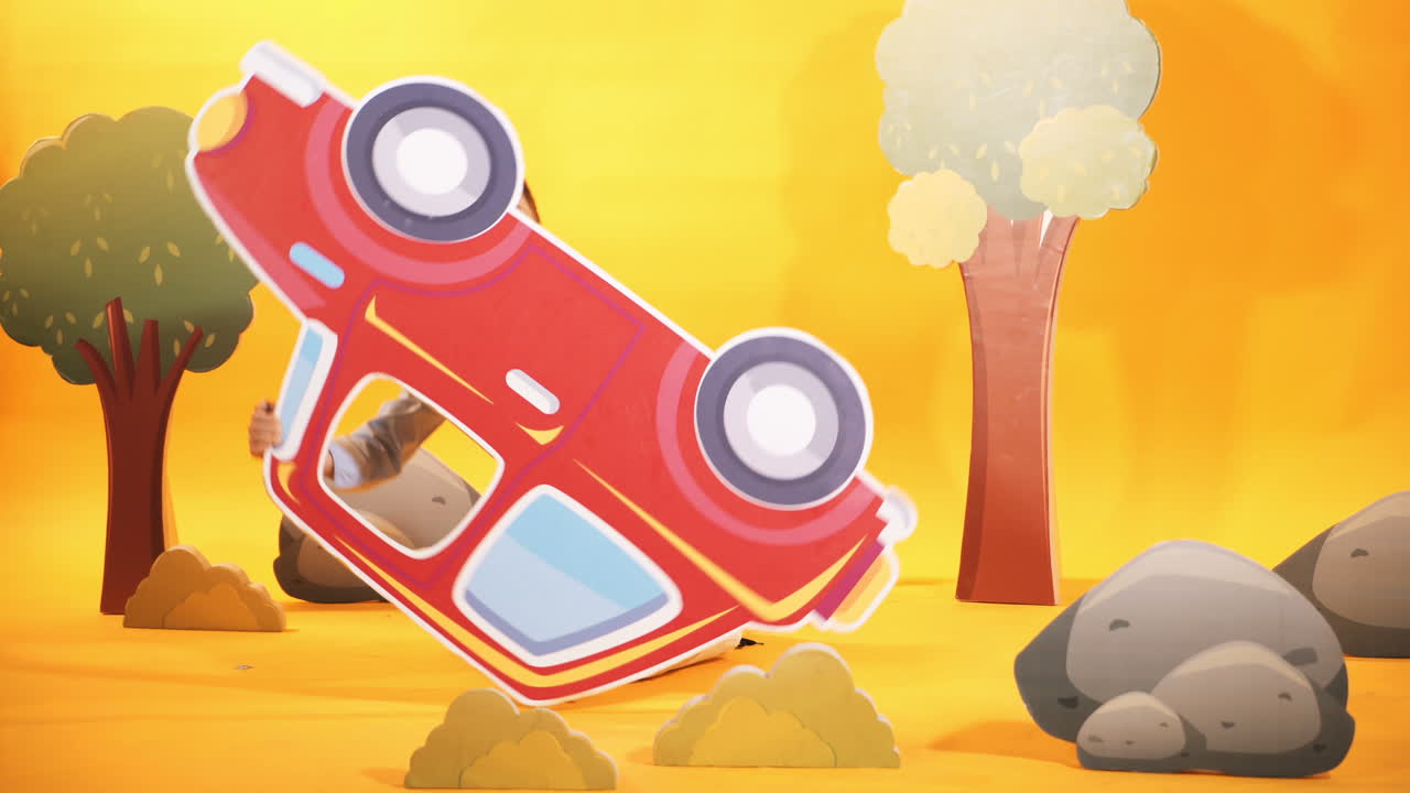 Cheerful little boy is playing with a big car. Decorative background. Studio shooting of children