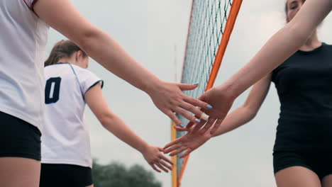 Close-up-greeting-the-hands-of-girls-volleyball-players-thanking-the-opponent-for-the-last-match-in-slow-motion