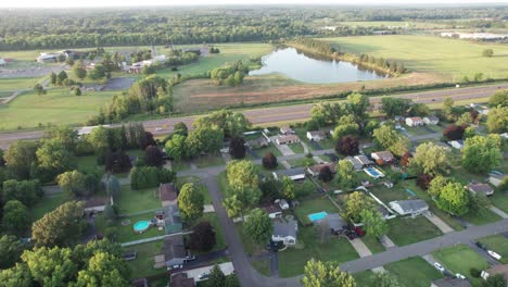 an aerial view of residential neighborhood with beautiful lake in horizontal line