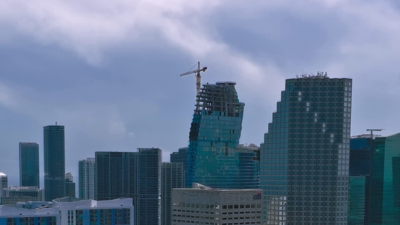 Aerial view of Miami skyline with tall buildings and construction site