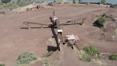 Aerial-orbits-conveyor-belt-at-underground-shoreline-mine-entrance